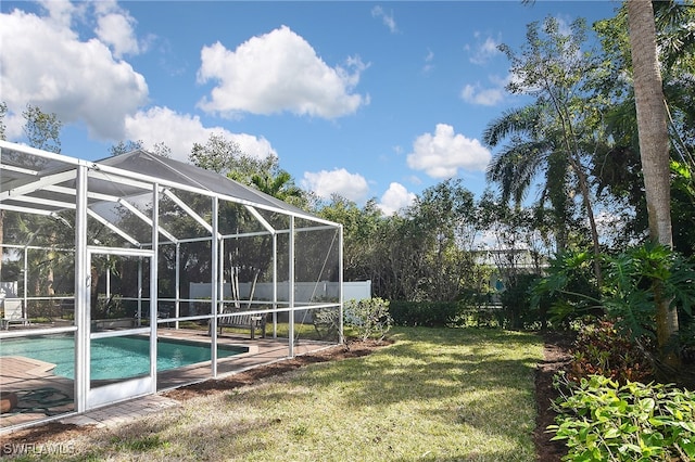 12660 Coconut Creek Ct, Fort Myers, FL 33908 - view of swimming pool with a yard and glass enclosure