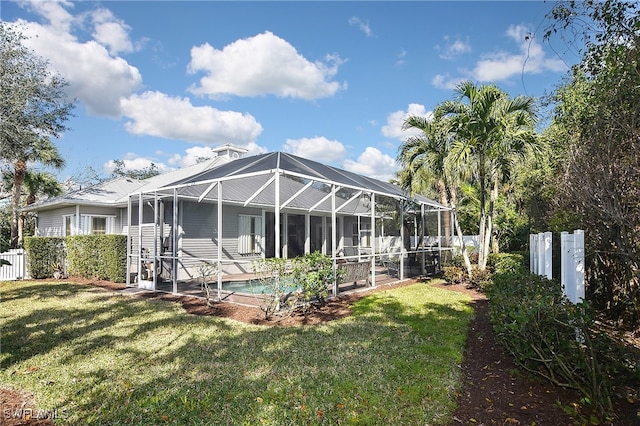 12660 Coconut Creek Ct, Fort Myers, FL 33908 - back of house featuring a fenced in pool, a lanai, and a yard