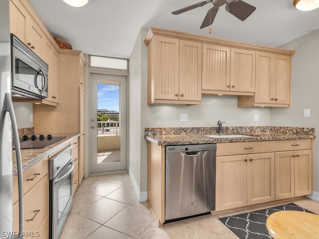 kitchen with appliances with stainless steel finishes, ceiling fan, light brown cabinets, sink, and light tile flooring