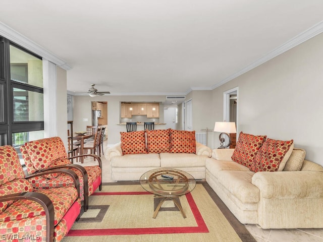 living room with crown molding and ceiling fan