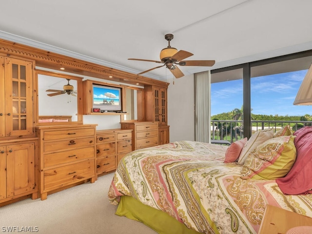 bedroom with light colored carpet, ceiling fan, and access to outside