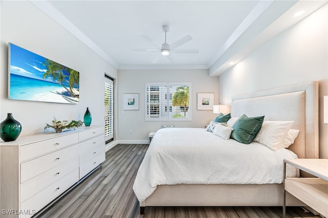 bedroom featuring ceiling fan, ornamental molding, and hardwood / wood-style flooring