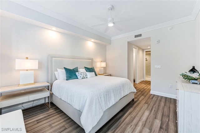 bedroom with wood-type flooring, ceiling fan, and ornamental molding