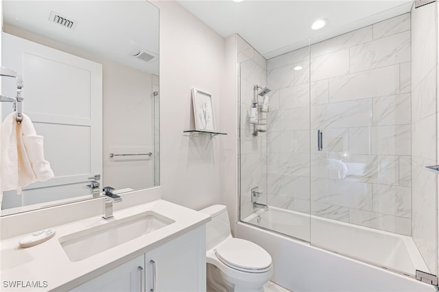 full bathroom with vanity, combined bath / shower with glass door, and toilet