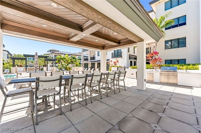 view of patio with a grill