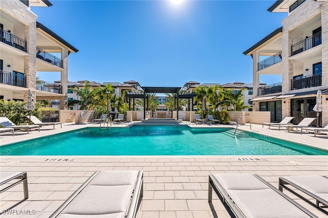 view of pool with a patio area and a pergola