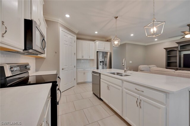 kitchen featuring backsplash, stainless steel appliances, and white cabinetry