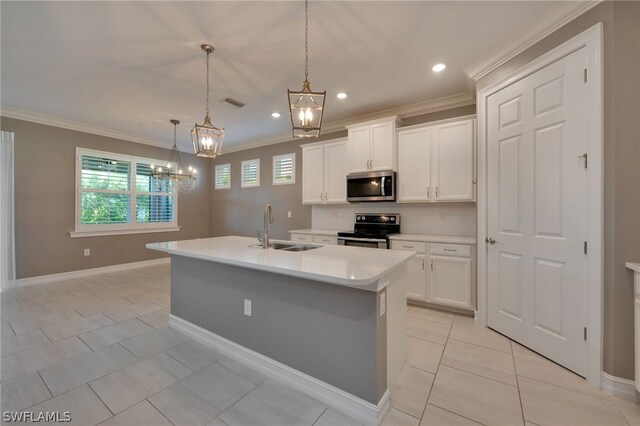 kitchen with sink, white cabinetry, hanging light fixtures, stainless steel appliances, and an island with sink