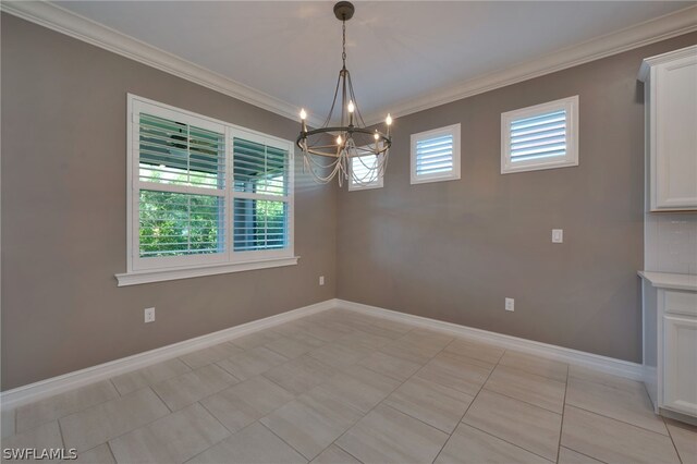 tiled empty room featuring a notable chandelier and ornamental molding