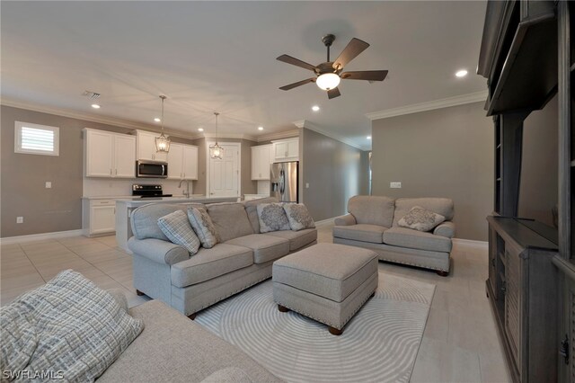 tiled living room featuring crown molding, ceiling fan, and sink