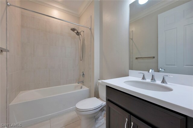 full bathroom featuring crown molding, tiled shower / bath combo, tile floors, vanity, and toilet