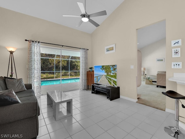 tiled living room featuring high vaulted ceiling and ceiling fan