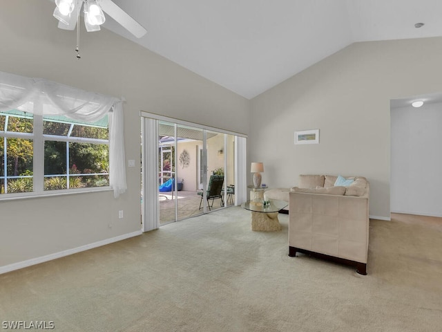 unfurnished living room featuring high vaulted ceiling, carpet floors, and ceiling fan