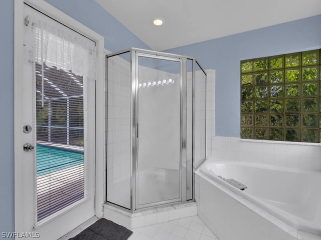 bathroom with separate shower and tub and tile flooring