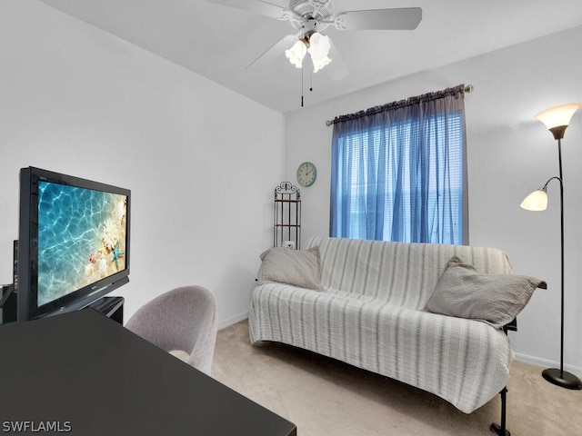 carpeted living room featuring ceiling fan