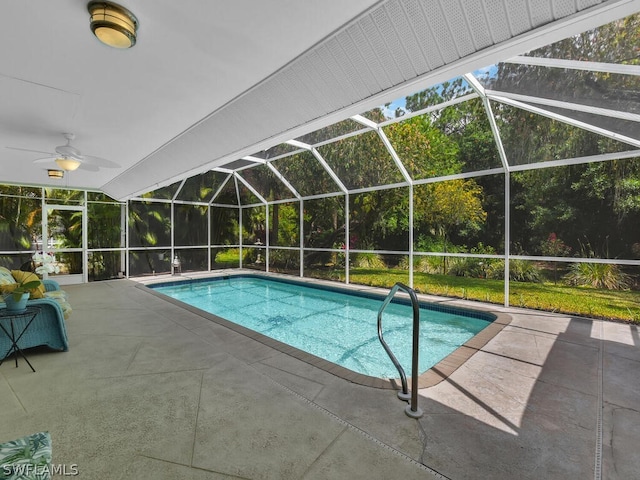 view of swimming pool with a lanai, ceiling fan, and a patio area