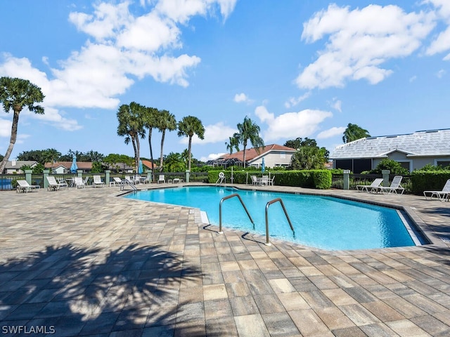 view of swimming pool featuring a patio