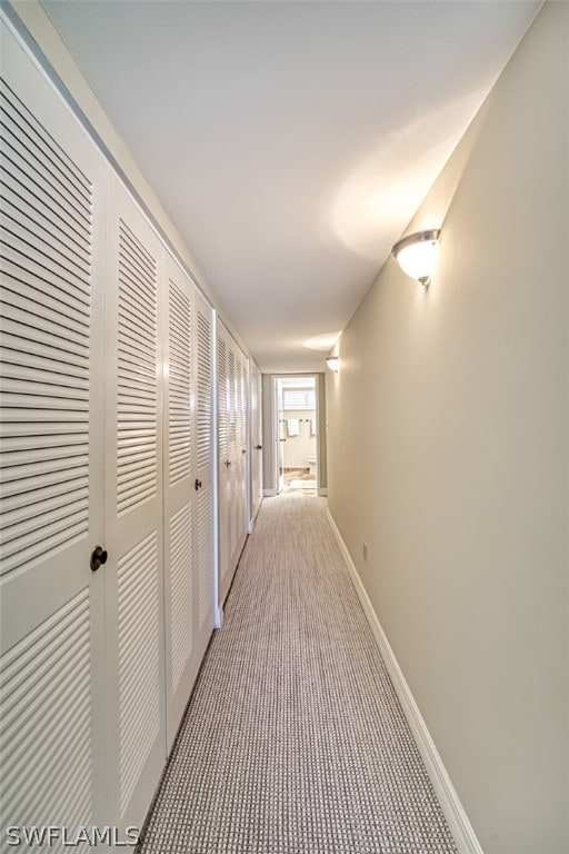 corridor with light carpet