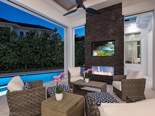 view of patio / terrace with ceiling fan and an outdoor living space