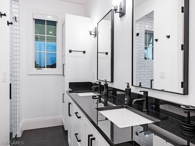 bathroom featuring tile patterned flooring and vanity