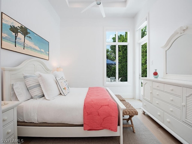 bedroom with ceiling fan and wood-type flooring