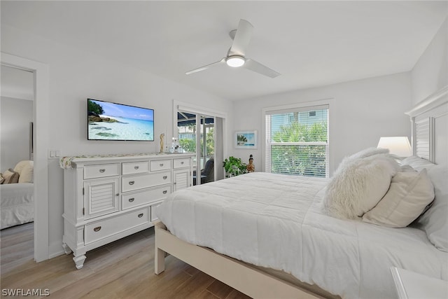 bedroom with ceiling fan, access to exterior, and light hardwood / wood-style floors