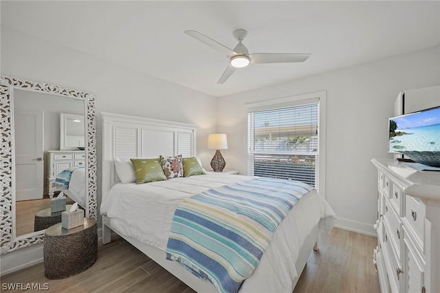 bedroom with ceiling fan and light wood-type flooring