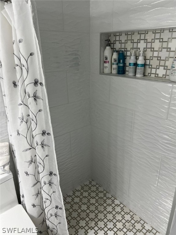 bathroom featuring walk in shower