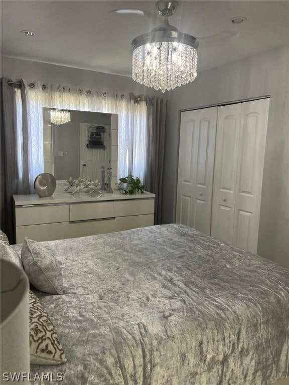 bedroom featuring a closet and a chandelier