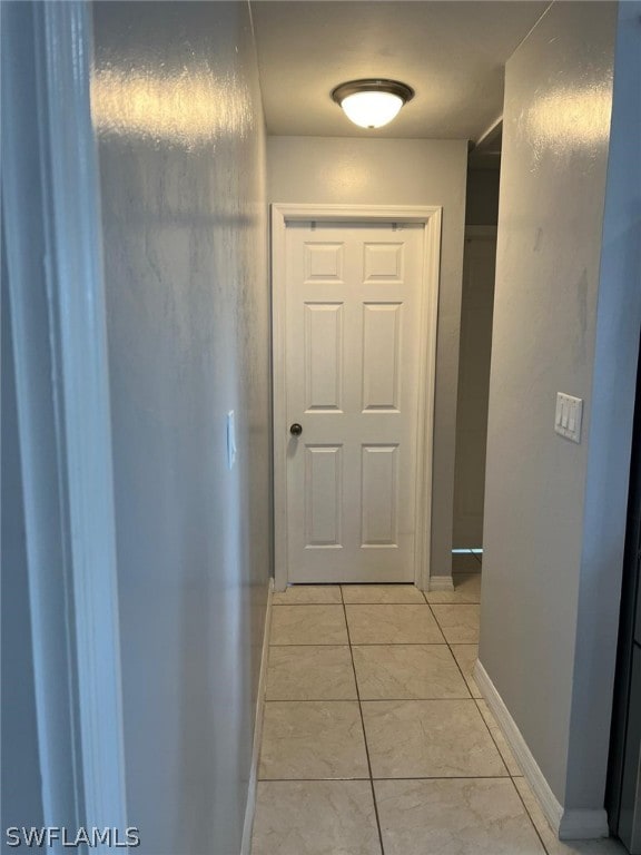 hallway with light tile floors