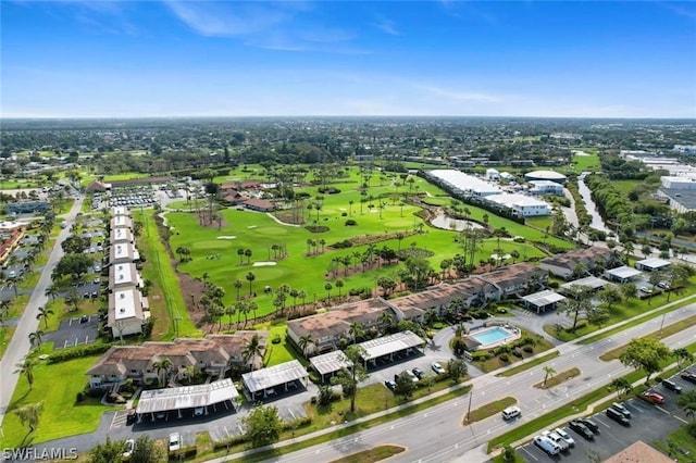 birds eye view of property with view of golf course