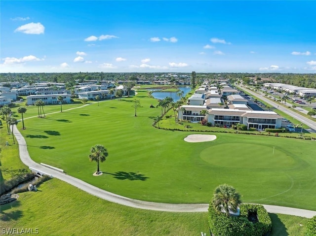 aerial view with a water view and golf course view