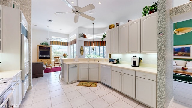 kitchen featuring ceiling fan, white cabinets, pendant lighting, and white dishwasher