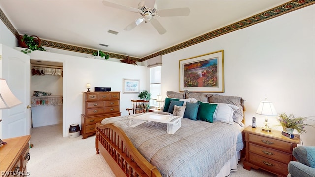 bedroom featuring ceiling fan and a closet