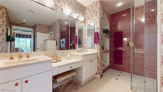 bathroom with vanity and a shower with shower door