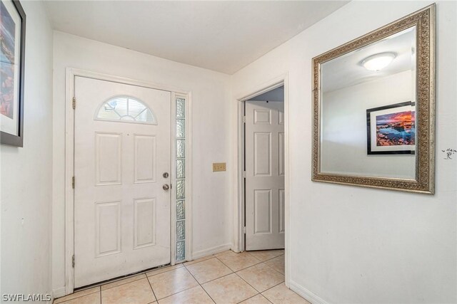 foyer with light tile patterned floors