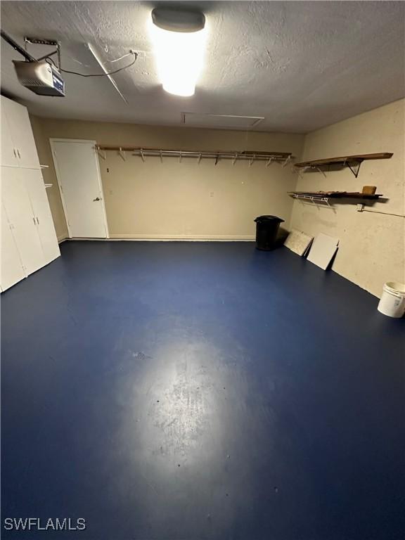 basement featuring a textured ceiling