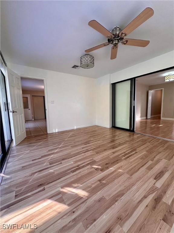 spare room with light hardwood / wood-style floors