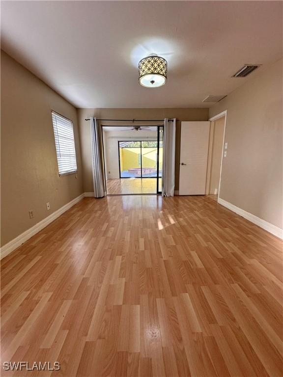 spare room featuring light hardwood / wood-style flooring