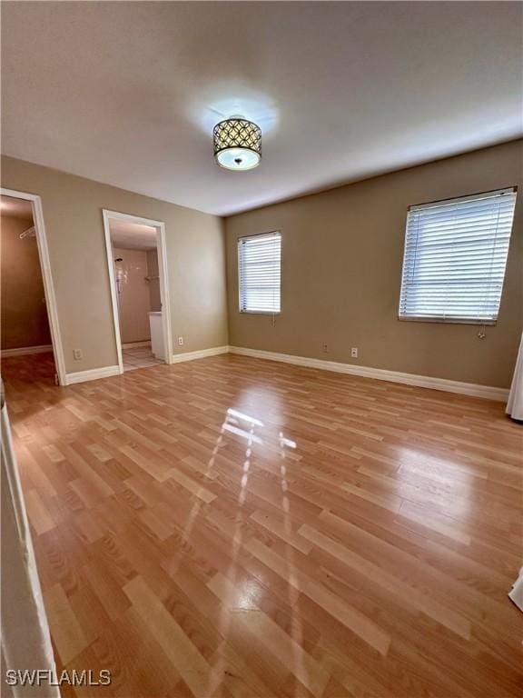 unfurnished room featuring light wood-type flooring