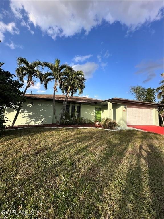 single story home with a garage and a front yard