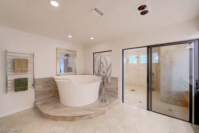 full bath with a soaking tub, visible vents, and recessed lighting