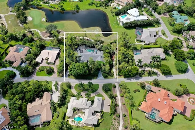 drone / aerial view with a residential view and a water view