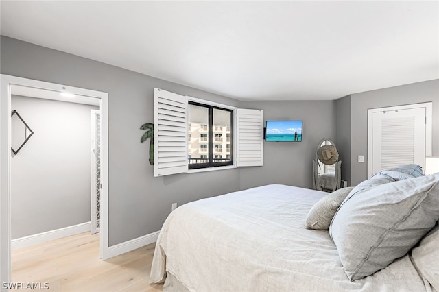 bedroom with light wood-type flooring