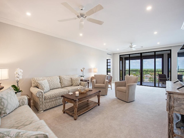 living room featuring ceiling fan, floor to ceiling windows, crown molding, and light carpet