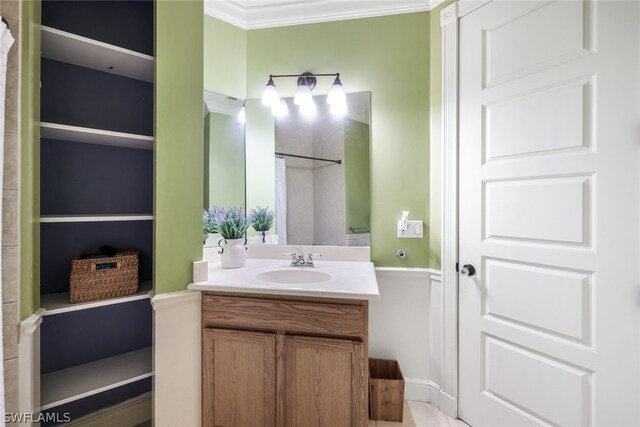 bathroom with vanity and ornamental molding