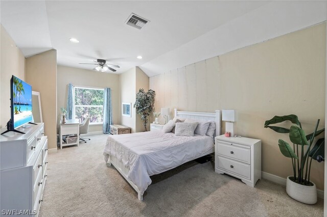 bedroom with light colored carpet, ceiling fan, and lofted ceiling