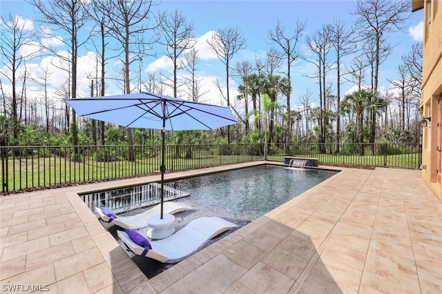 view of pool featuring pool water feature and a patio area