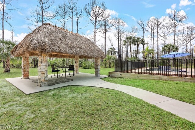 view of community with a gazebo, a yard, and a patio