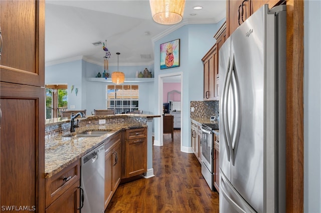 kitchen featuring sink, hanging light fixtures, stainless steel appliances, dark hardwood / wood-style flooring, and ornamental molding